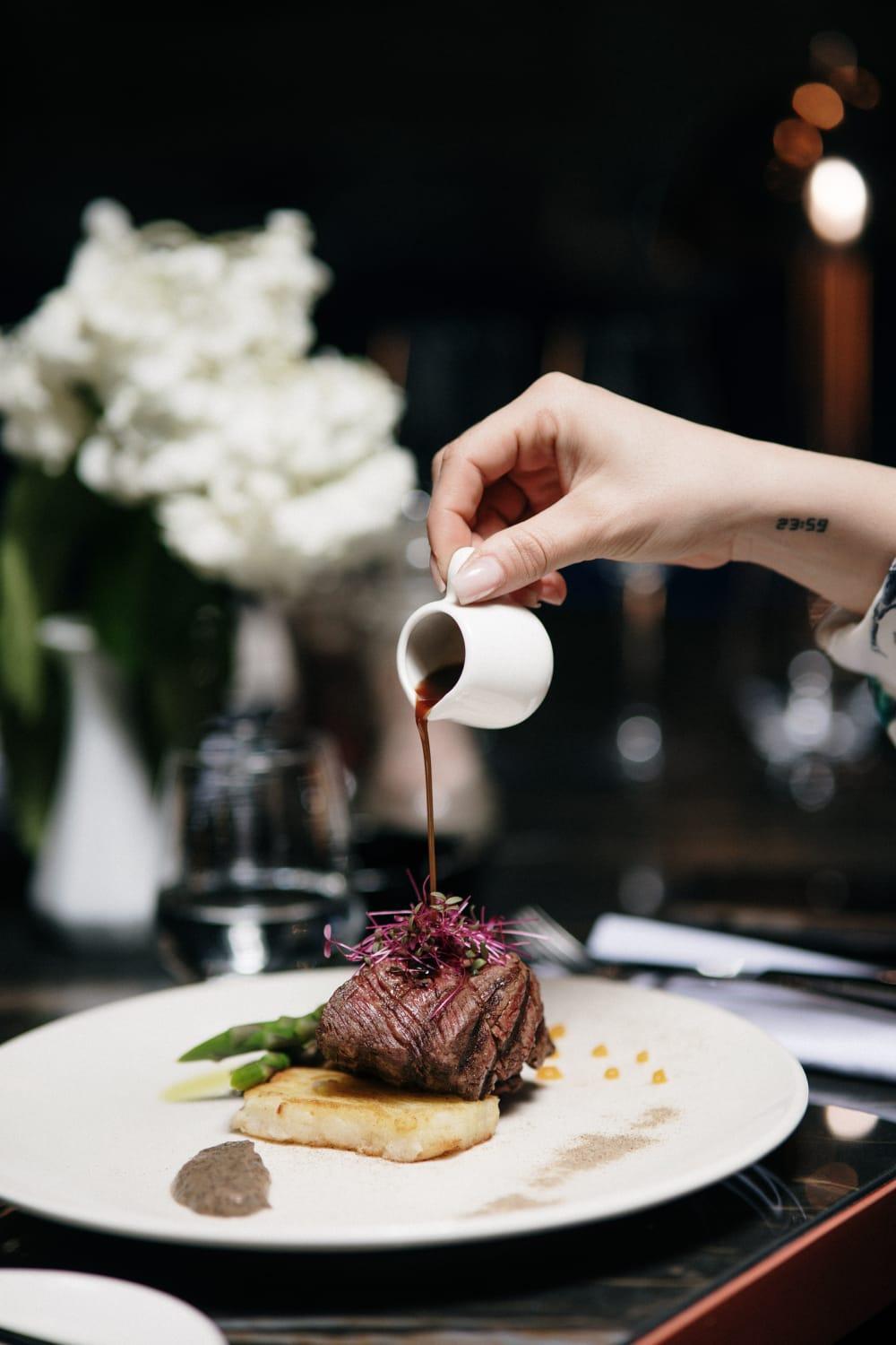 Xheko Imperial Luxury Hotel & Spa Тирана Екстер'єр фото A server pours soy sauce onto a dish